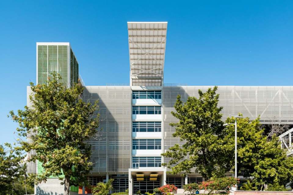 large white building surrounded by trees